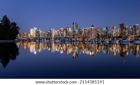 Panoramic view of Downtown Vancouver cityscape during sunset from Stanley Park sea wall, Vancouver, British Columbia, Canada