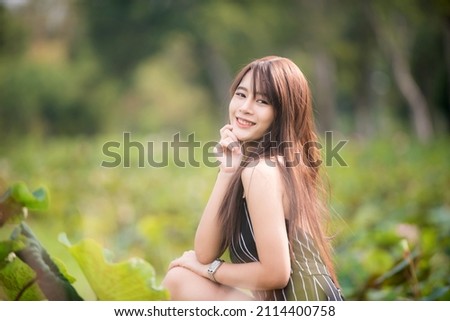 Portrait of a cheerful, smiling woman relaxing in a holiday park