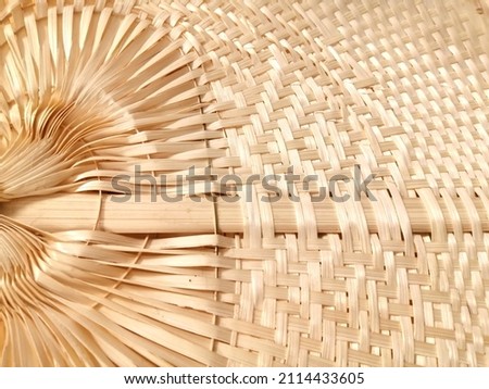 Bamboo texture of a traditional fan.Wickerwork bamboo texture background.Wicker rattan seamless texture for background. Abstract​ of​ wickerwork for​ background. wicker surface made of wooden rods.