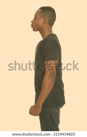 Portrait of young handsome African man standing