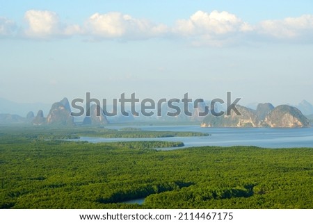 Landscape nature of Samet Nangshe Viewpoint is the fantastic limestone formations on the bay  with green mangrove forest panoramic viewpoint in Phang Nga Bay in sunny day locate at Phang Nga Thailand