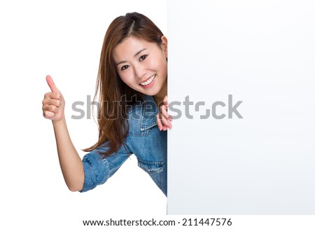 Happy woman with blank placard and thumb up