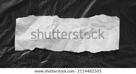Torn crumpled paper texture, copy space for advertising message. Royalty-Free Stock Photo #2114482505
