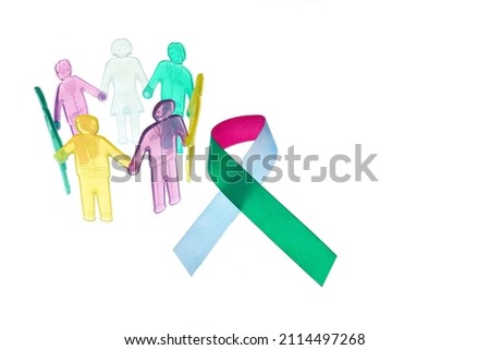 Rare Disease Day Background. Colorful awareness ribbon with group of people with rare diseases. Royalty-Free Stock Photo #2114497268