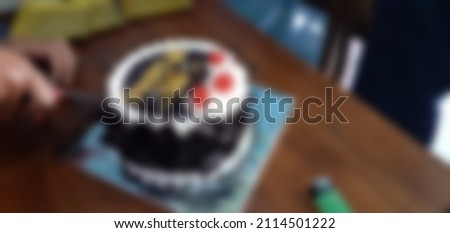 Birthday cake on an unfocused table
