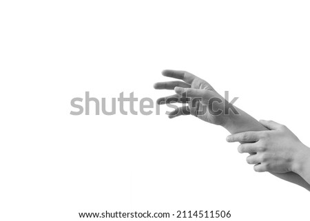 Stop Don't go there. Do not touch that. Hand that tries to reach someone or something, and the other hand does not allow it. Black and white minimal arms gesture concept on white background. Royalty-Free Stock Photo #2114511506