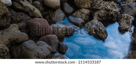 Rocks on a serene blue sea