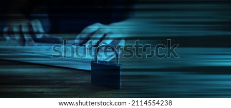 woman typing on the keyboard next to the lock