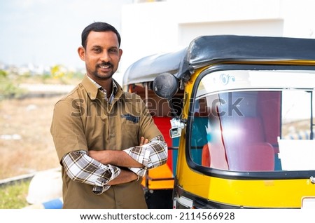 Happy confident driver with crossed arms standing by looking at camera - concept of confident, self employed and positive emotion. Royalty-Free Stock Photo #2114566928