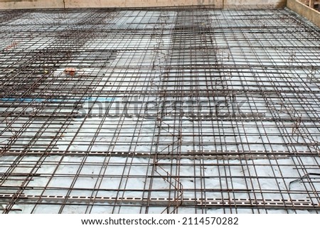 Reinforcement mats of a floor slab in house construction.