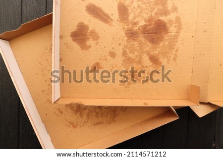 a pizza box with another slice of pizza
