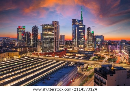 Milan, Italy with modern high rises in Porta Nuova at twilight. Royalty-Free Stock Photo #2114593124