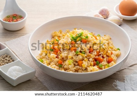 Thai Fried rice with egg and sliced carrot in white plate.Easy cooking food Royalty-Free Stock Photo #2114620487