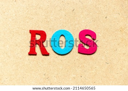 Color cloth alphabet letter in word ROS (Abbreviation of Return on sales) on wood background