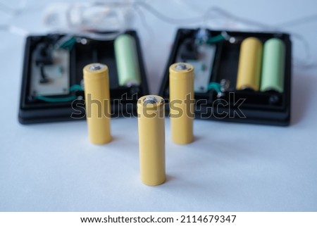 dead battery. dead rechargeable AA battery Royalty-Free Stock Photo #2114679347