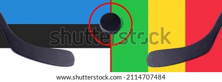 Top view hockey puck with Estonia vs. Mali command with the sticks on the flag. Concept hockey competitions