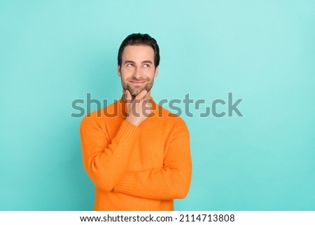 Photo of young man good mood hand touch chin curious look empty space isolated over teal color background Royalty-Free Stock Photo #2114713808