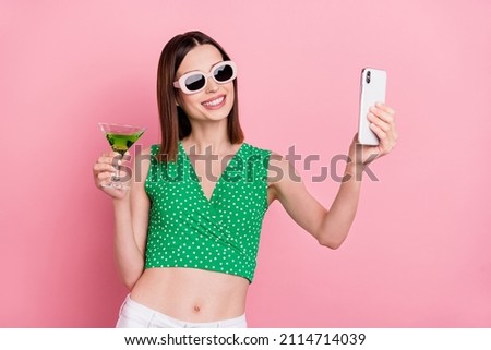 Photo of young lovely girl make selfie mobile drink cocktail trip eyewear isolated over pink color background