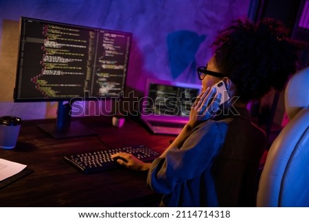 Phot of lady freelancer use modern gadget screen speak talk smart phone solve operating system error in evening late workplace Royalty-Free Stock Photo #2114714318
