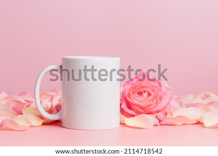 Mockup mug with rose and petals on pink background, coffee cup or mug for template and design Royalty-Free Stock Photo #2114718542