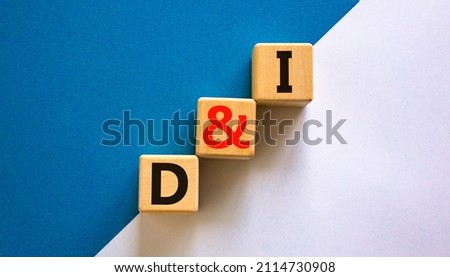 D and I, Diversity and inclusion symbol. Concept words D and I, diversity and inclusion on wooden cubes on beautiful blue table, white background. Business, D and I, diversity and inclusion concept.