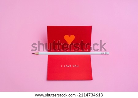 Valentines day greeting mockup with blank card and white pencil. Creative flat lay with empty space.
