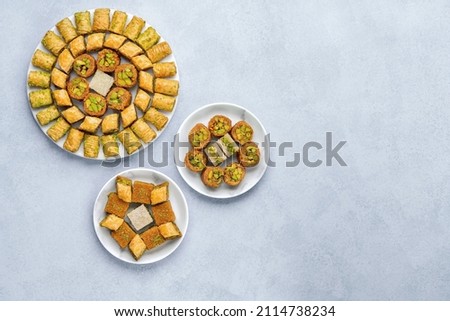 Traditional turkish, arabic dessert baklava assortment with pistachio. Ramadan sweets. Top view, copy space Royalty-Free Stock Photo #2114738234