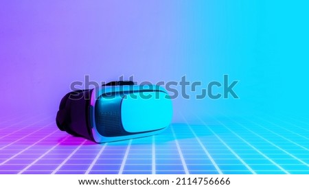 Virtual reality headset VR. 3d digital glasses on futuristic neon tech background. VR future gadgets technology, education online, studying, video game concept