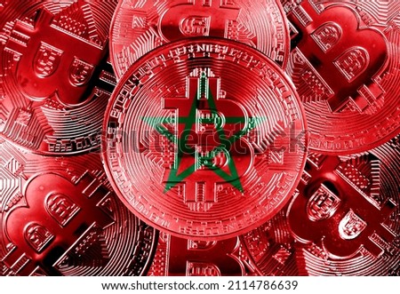 Holds a physical version of Bitcoin and the Morocco flag. Concept map of Morocco cryptocurrency and blockchain technology. Double exposure creative bitcoin symbol hologram. 