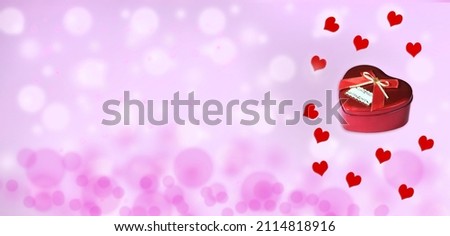 Red heart box with hearts on a cheerful pink background for Valentine's Day