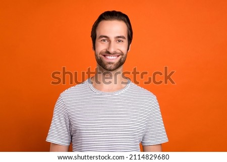 Photo of young cheerful guy toothy smile visit clinic oral care caries isolated over orange color background