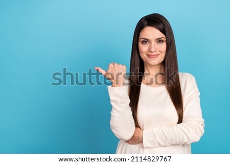 Photo of young lady promoter indicate thumb empty space suggest proposition decision isolated over blue color background Royalty-Free Stock Photo #2114829767