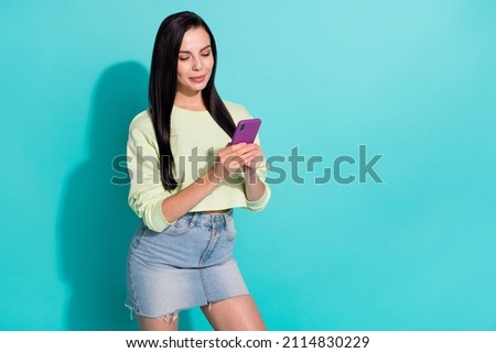Photo of positive lady use gadget search website app sale marketing isolated over cyan color background