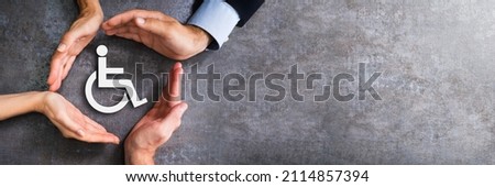 Hand Protecting Handicapped Symbol Concept. Disability Insurance