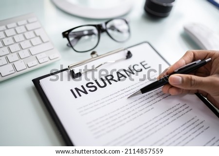 Company Insurance Policy Document. African American Agent Royalty-Free Stock Photo #2114857559
