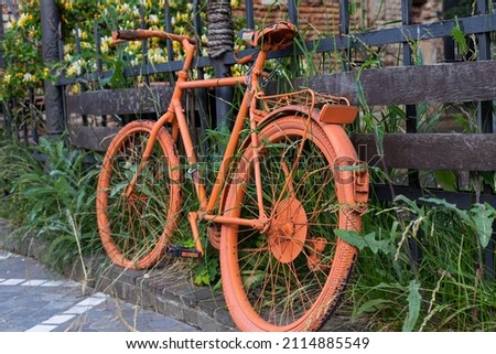 Picture of a vintage bike painted orange