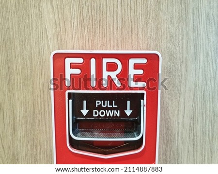 Red Fire Alarm Panel on the building wall