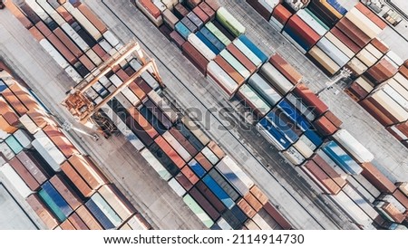 Aerial view of shipping container port terminal. Colourful pattern of containers in harbor. Maritime logistics global inport export trade transportation. Royalty-Free Stock Photo #2114914730