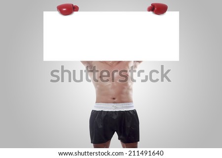 fight and competition sign with an red boxing glove holding a blank white banner as a business symbol of competitive sales or boxing day specials isolated on white background with clipping path