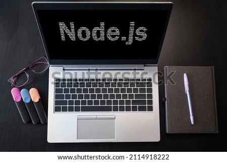 Top view of laptop with text Node.js. Node js inscription on laptop screen and keyboard. Learn node.js language, computer courses, training.  Royalty-Free Stock Photo #2114918222