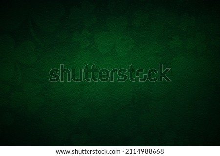 Magical green background with shamrock leaves. Patrick's Day celebration. Blurred image