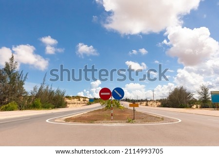 Coastal road with road sign in Phan Thiet, Mui Ne, Viet Nam. beautiful landsacpe with blue sky and white cloud in summer day