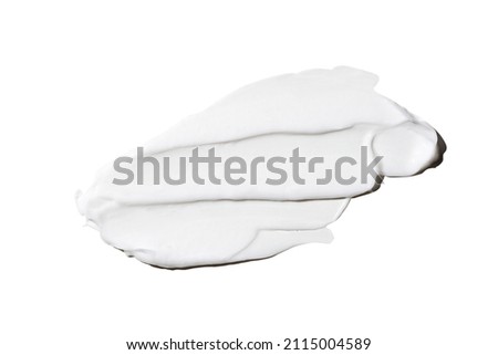 Liquid white cream smear isolated on white background. Beauty cosmetic smudge such as hair conditioner, creamy lotion, facial retinol serum, mask balm, cleanser, shower gel or shampoo top view. Royalty-Free Stock Photo #2115004589