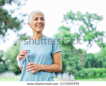 Portrait of a happy active beautiful senior woman posing after exercicing outdoors Royalty-Free Stock Photo #2115005990