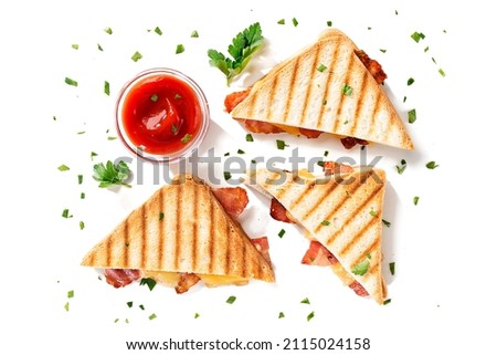 Delicious toasted sandwiches with cheddar cheese and bacon isolated on white background, top view Royalty-Free Stock Photo #2115024158