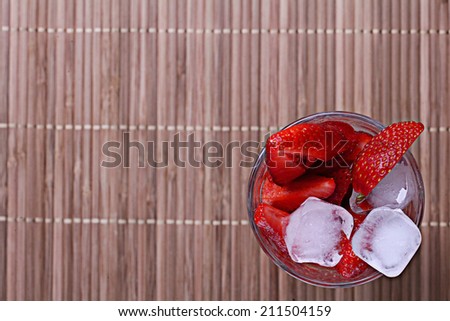 fresh strawberries in a cocktail glass with ice