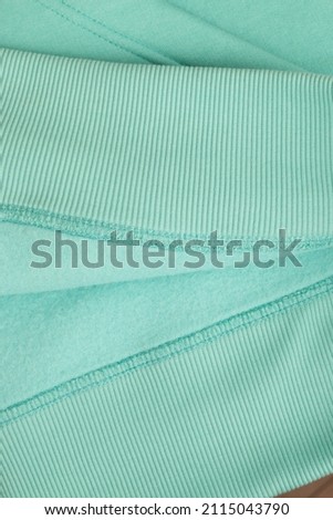 Hoodie texture. Close-up shot of sweatshirt hoodie brown textile warm fabric macro background. Blue color 