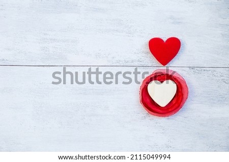 Two heart on white wooden table background, love and romance symbole, valentine card background idea