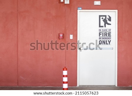 White door fire exit in the car park building.