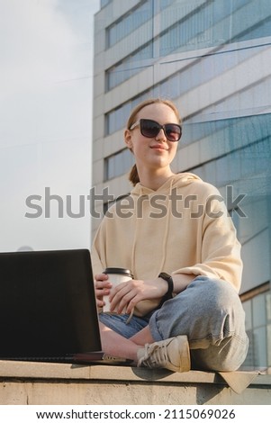 Investment. Young woman investor buys stocks on the stock exchange stock market from home. Generation z invests budget analyzes income of digital money. Cryptocurrency trading. Investor freelancing Royalty-Free Stock Photo #2115069026